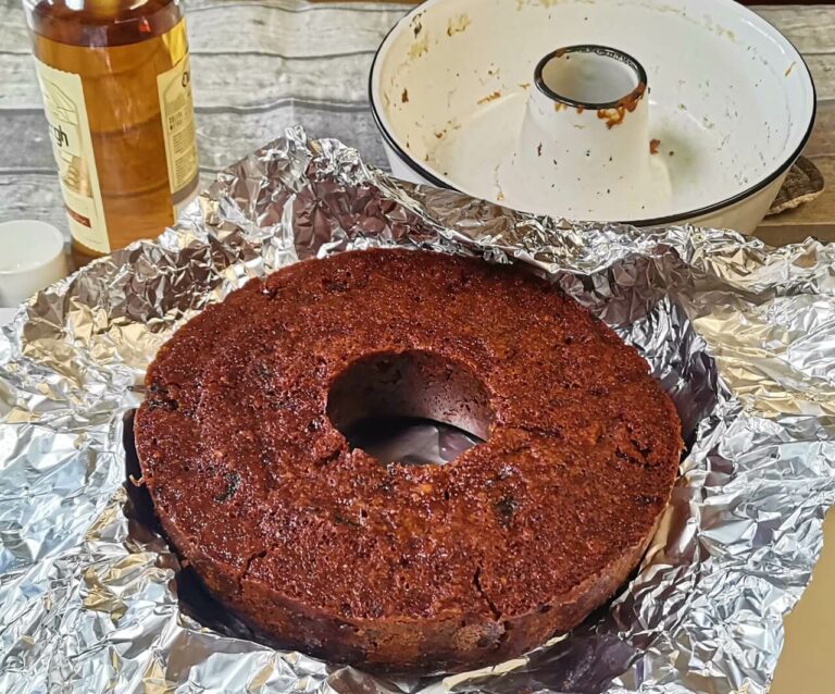 Fruit Cake in foil ready to be soaked with brandy.