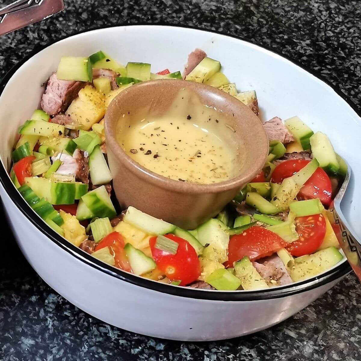 Tapas Bowl Country Style Tapas Bowl with a light summer salad and some dip in a Soufflé Dish in the middle of the bowl