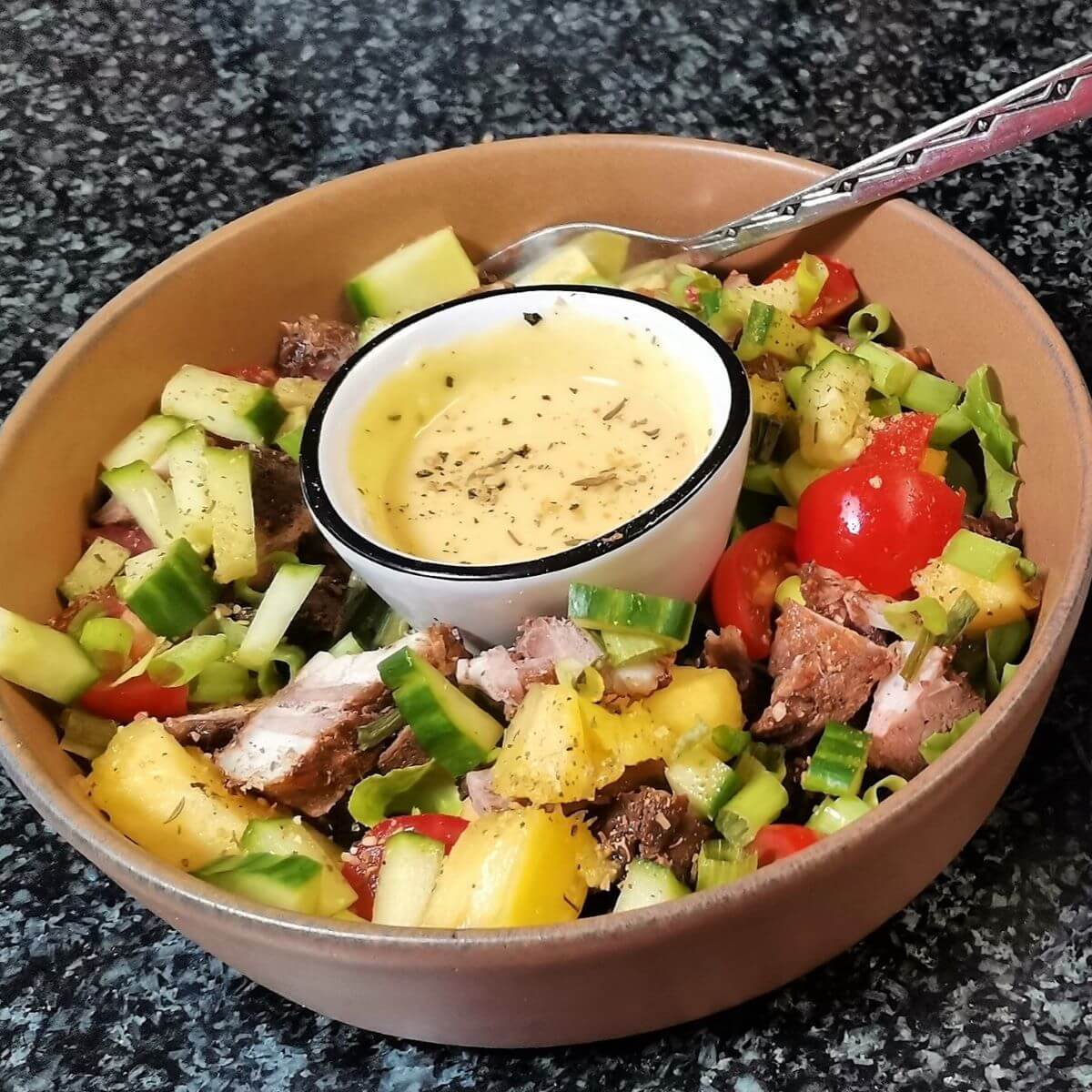 Tapas Bowl Sandstorm Tapas Bowl with a light summer salad and some dip in a Soufflé Dish in the middle of the bowl